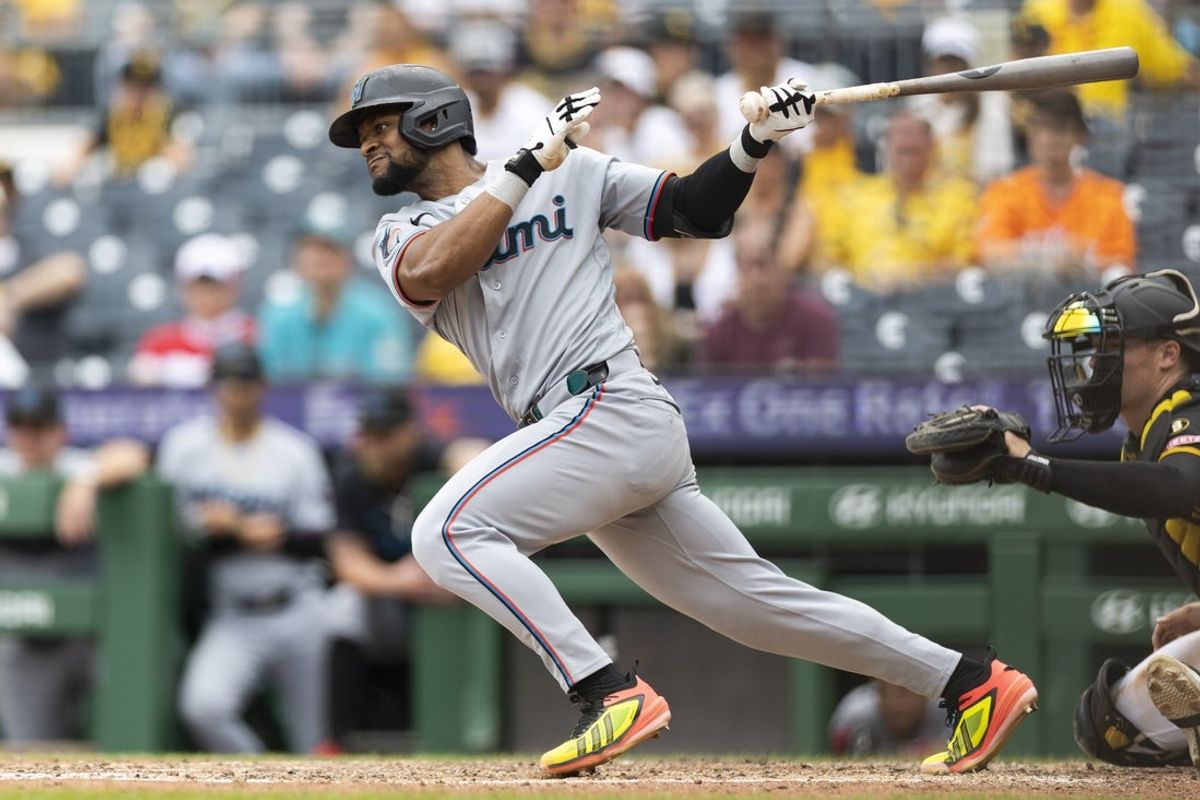 Jun 14, 2026; Pittsburgh, Pennsylvania, USA;  Miami Marlins shortstop Otto Lopez (6) hits a single against the Pittsburgh Pirates during the eighth inning at PNC Park. Mandatory Credit: Scott Galvin-Imagn Images