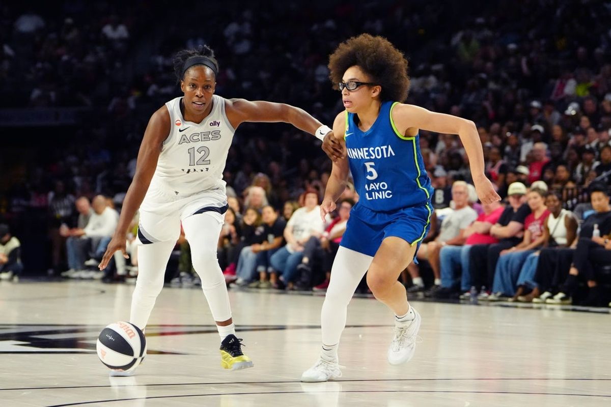 Jun 13, 2026; Las Vegas, Nevada, USA; Las Vegas Aces guard Chelsea Gray (12) dribbles past Minnesota Lynx guard Olivia Miles (5) during the third quarter at Michelob Ultra Arena. Mandatory Credit: Stephen R. Sylvanie-Imagn Images
