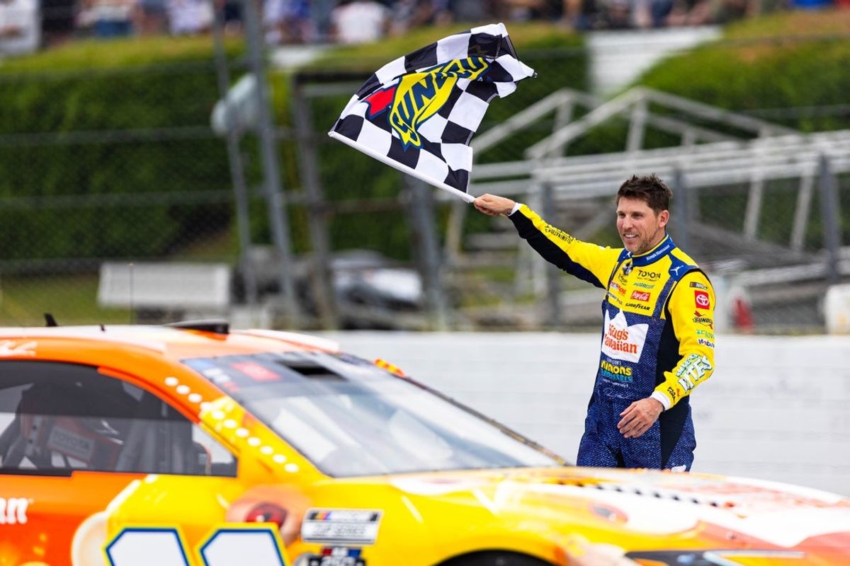NASCAR Cup Series Driver Denny Hamlin celebrates his win at the Great American Getaway 400 at Pocono Raceway on June 14, 2026.