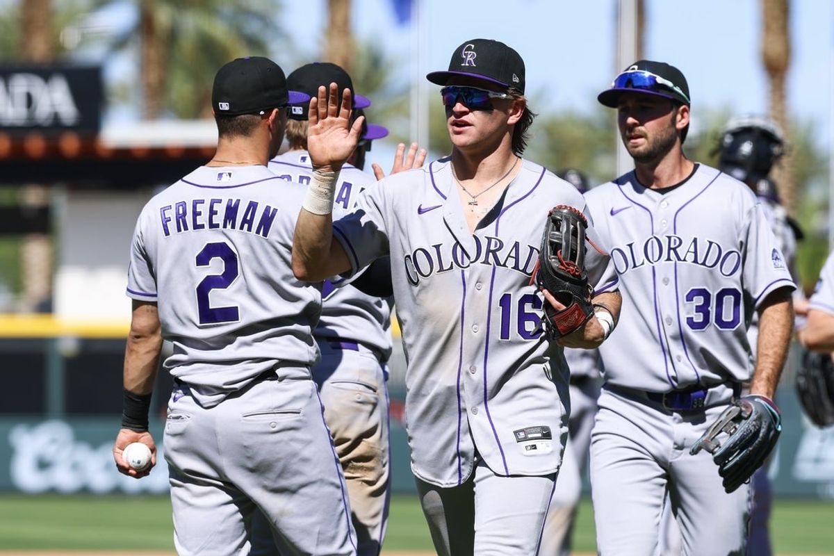 Jun 14, 2026; Summerlin, Nevada, USA; Colorado Rockies outfielder Cole Carrigg (16), Colorado Rockies right fielder Sterlin Thompson (30) congratulate their teammates for the win against the Athletics at Las Vegas Ballpark. Mandatory Credit: Boz Bloom-Imagn Images