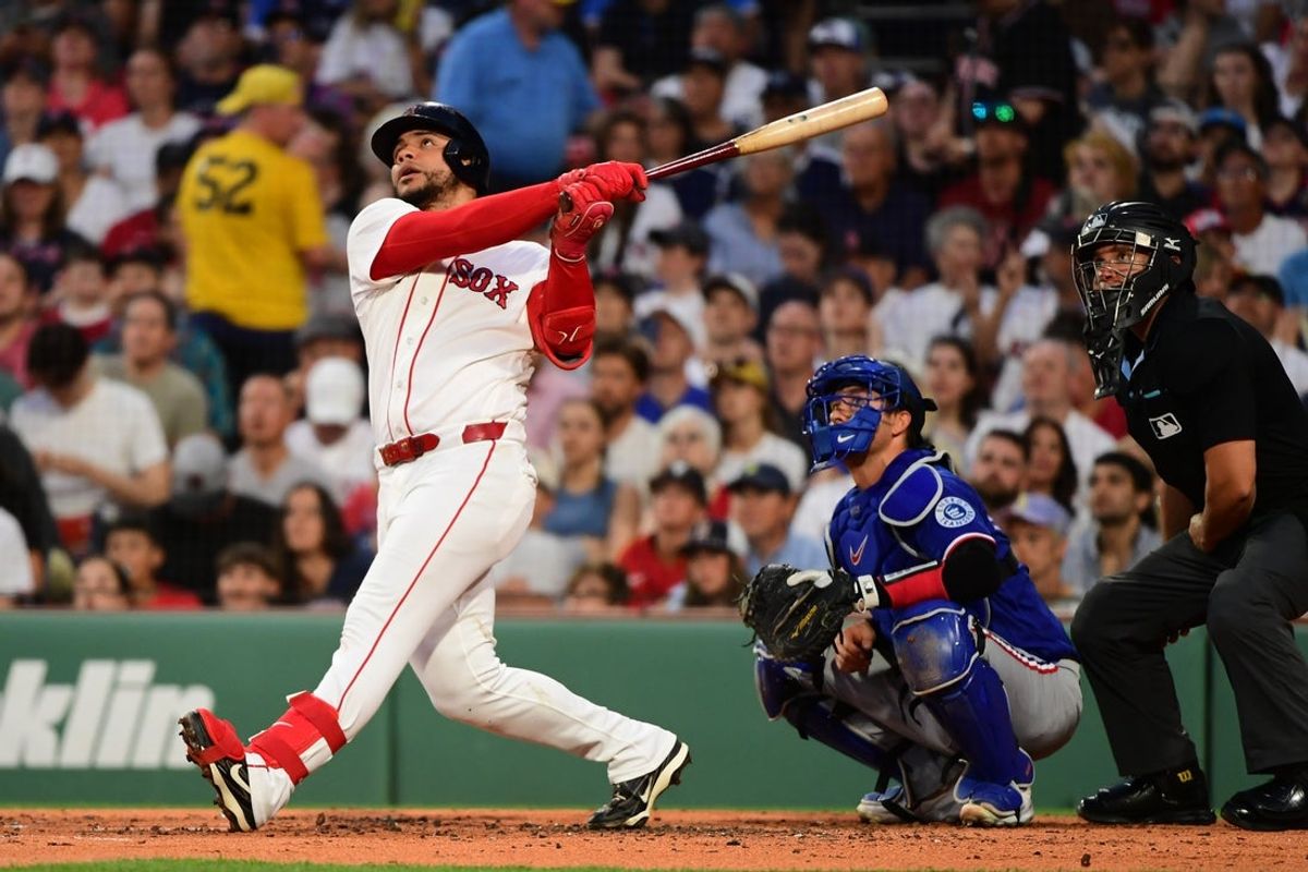 Jun 14, 2026; Boston, Massachusetts, USA;  Boston Red Sox first baseman Willson Contreras (40) hits a home run during the second inning against the Texas Rangers at Fenway Park. Mandatory Credit: Bob DeChiara-Imagn Images