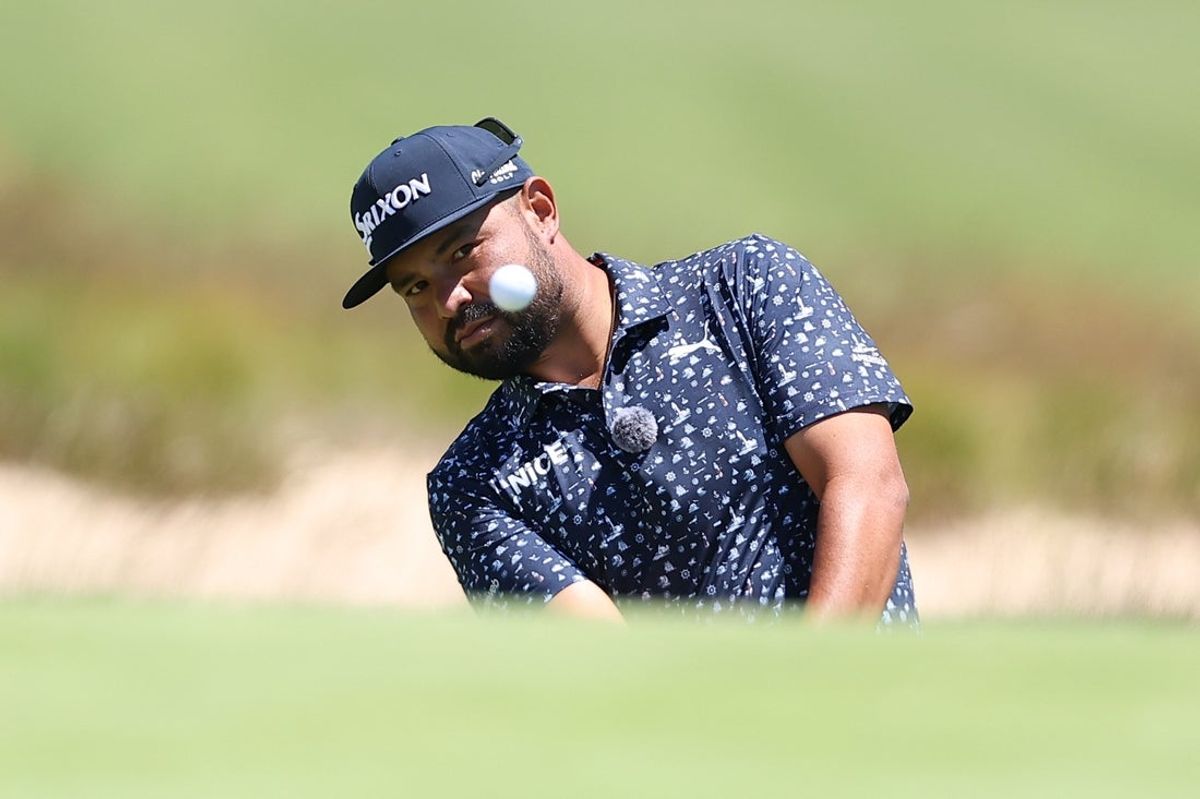Jun 15, 2026; Southampton, New York, USA; J.J. Spaun plays a shot from a bunker on hole 13 during a practice round for the U.S. Open golf tournament. Mandatory Credit: Bill Streicher-Imagn Images
