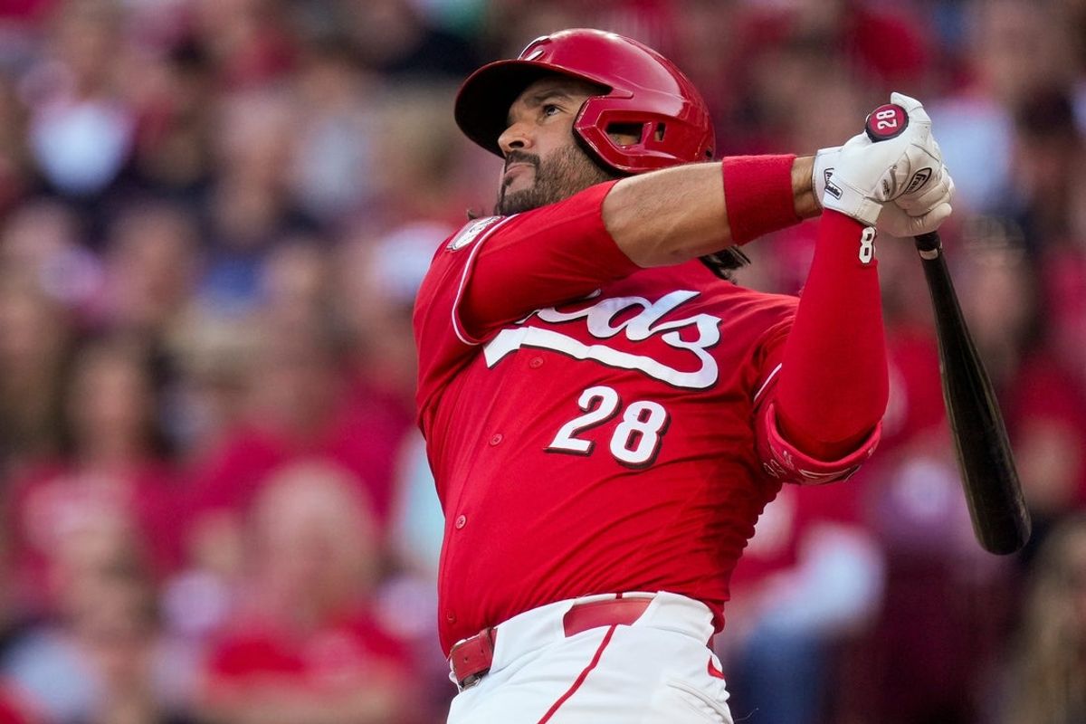 Cincinnati Reds third baseman Eugenio Suárez (28) follows through on a grand slam in the second inning of the MLB National League game between the Cincinnati Reds and the New York Mets at Great American Ball Park in Cincinnati on Monday, June 15, 2026.