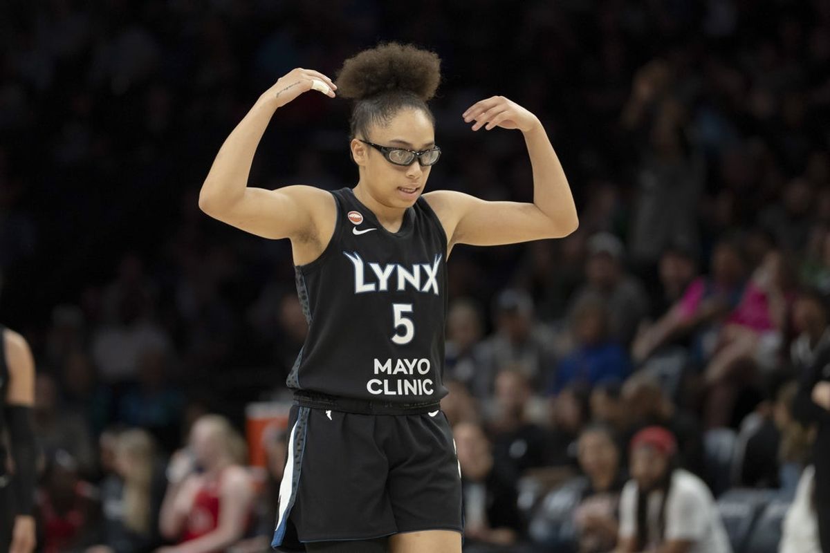 Jun 15, 2026; Minneapolis, Minnesota, USA; Minnesota Lynx guard Olivia Miles (5) raises her arm over her head to make the crowd cheer louder against the Portland Fire in the first half at Target Center. Mandatory Credit: Jesse Johnson-Imagn Images
