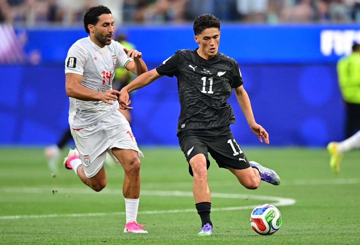 June 15, 2026; Inglewood, California, U.S.; New Zealand's Elijah Just in action with Iran's Saman Ghoddos.  Mandatory Credit: Gary Vasquez-Imagn Images