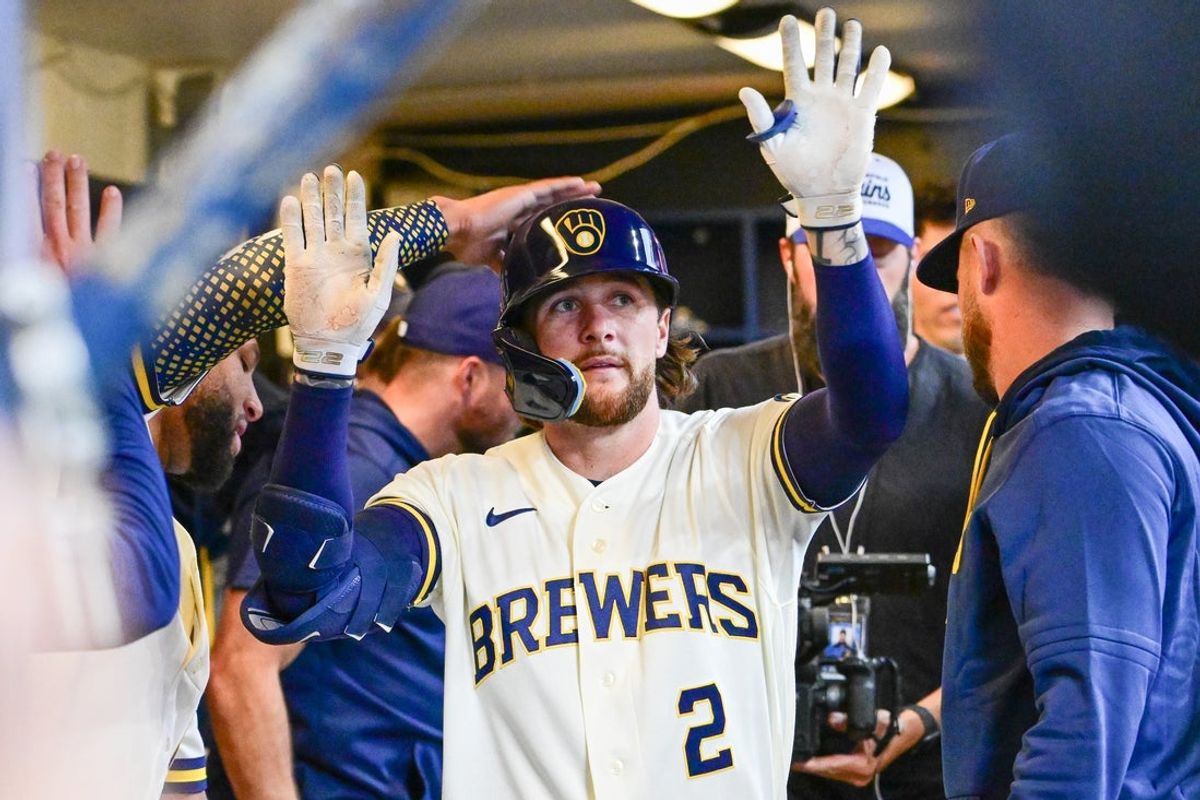 Jun 16, 2026; Milwaukee, Wisconsin, USA;  Milwaukee Brewers second baseman Brice Turang (2) is greeted in the dugout after hitting a solo home run in the fourth inning against the Cleveland Guardians at American Family Field. Mandatory Credit: Benny Sieu-Imagn Images