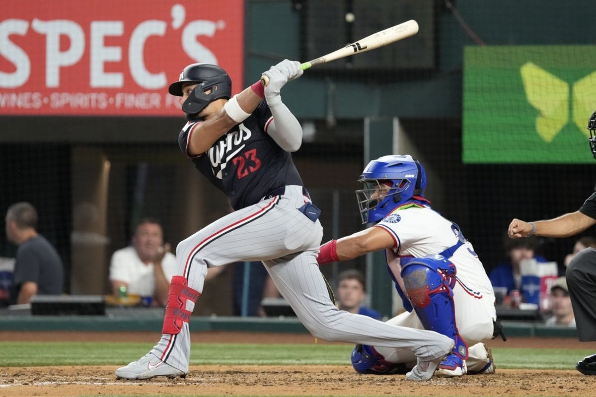 Jun 16, 2026; Arlington, Texas, USA; Minnesota Twins first baseman Royce Lewis (23) follows through on his two-run single against the Minnesota Twins during the fourth inning at Globe Life Field. Mandatory Credit: Jim Cowsert-Imagn Images
