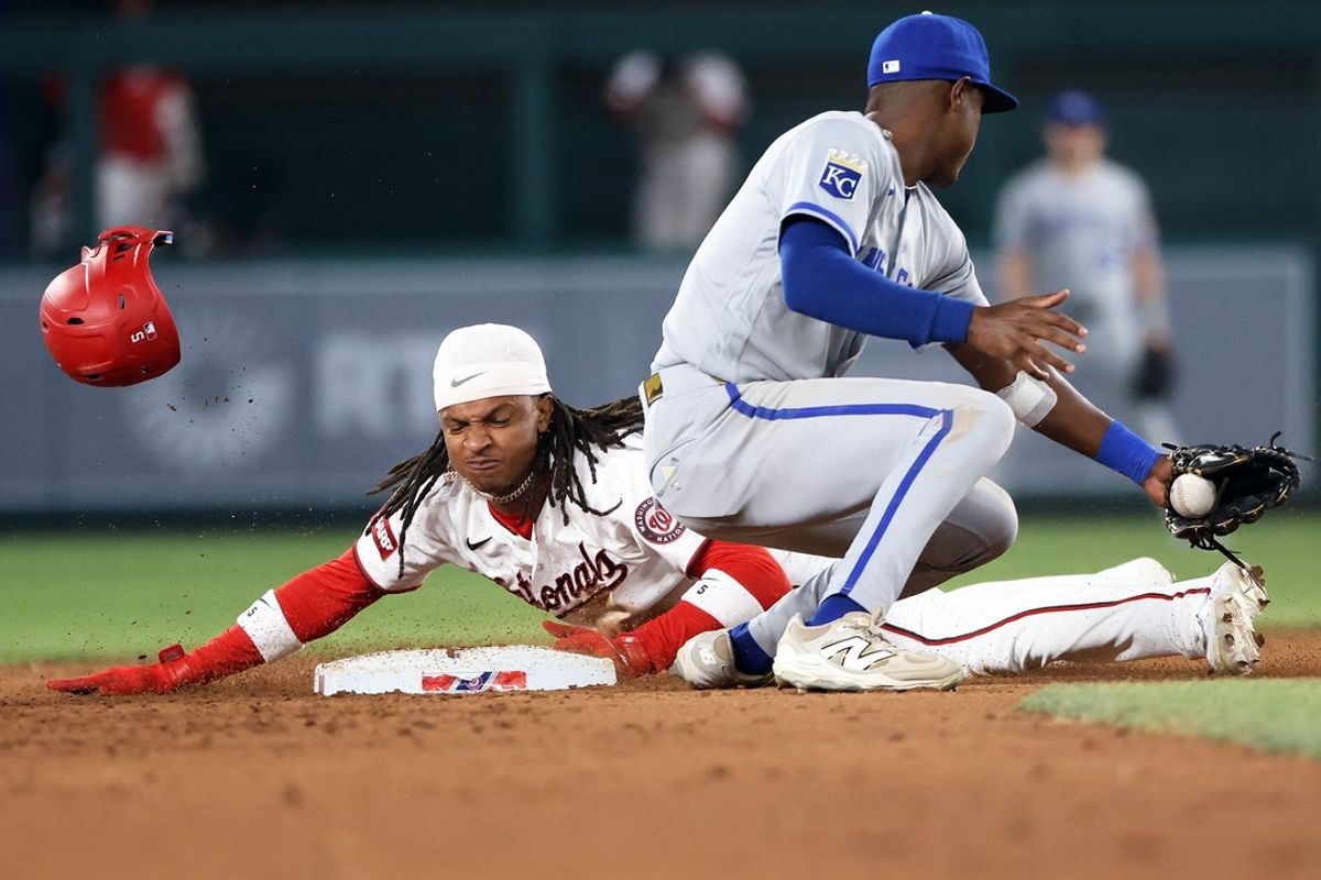 Jun 16, 2026; Washington, District of Columbia, USA; Washington Nationals shortstop CJ Abrams (5) slides into second base safely past Kansas City Royals left fielder Tyler Tolbert (2) during the seventh inning at Nationals Park. Mandatory Credit: Daniel Kucin Jr.-Imagn Images