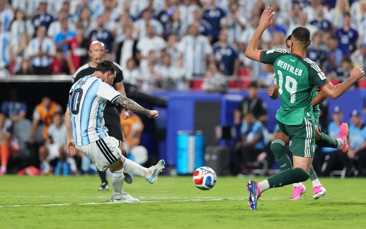 June 16, 2026; Kansas City, Missouri, U.S.; Argentina's Lionel Messi scores their third goal to complete a hat-trick.  Mandatory Credit: Jay Biggerstaff-Imagn Images