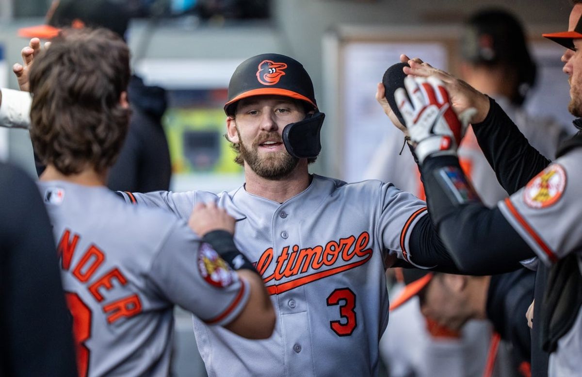 Jun 16, 2026; Seattle, Washington, USA;  Baltimore Orioles left fielder Taylor Ward (3) celebrates in the dugout after scoring a run during the first inning against the Seattle Mariners at T-Mobile Park. Mandatory Credit: Stephen Brashear-Imagn Images