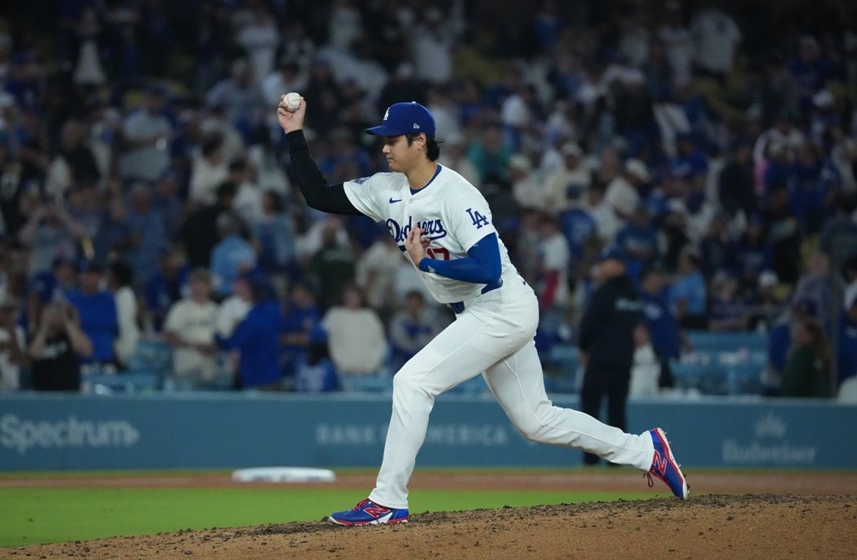 Jun 16, 2026; Los Angeles, California, USA; the Los Angeles Dodgers' Shohei Ohtani practices throwing from the pitcher's mound following a win over the Tampa Bay Rays at Dodger Stadium. Mandatory Credit: Kirby Lee-Imagn Images