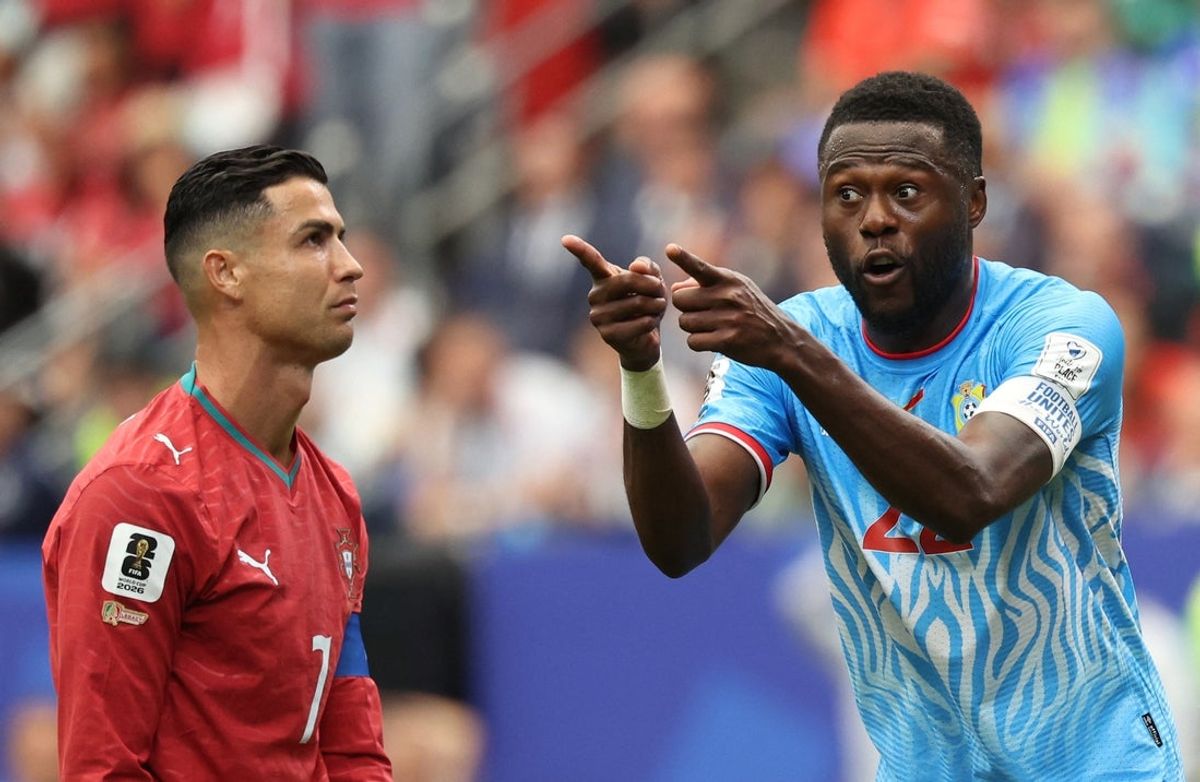 June 17, 2026; Houston, Texas, U.S.; Portugal's Cristiano Ronaldo and DR Congo's Chancel Mbemba react.  Mandatory Credit: Troy Taormina-Imagn Images