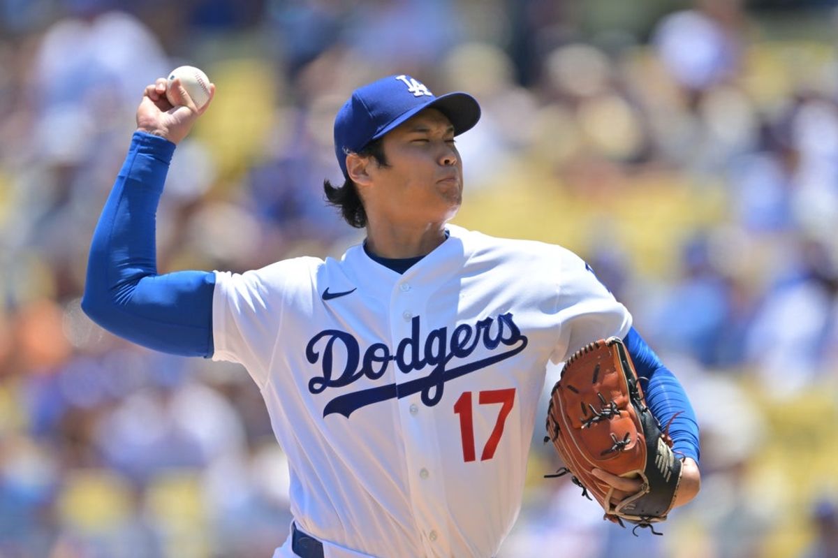 17 de junho de 2026; Los Angeles, Califórnia, EUA; O arremessador titular do Los Angeles Dodgers, Shohei Ohtani (17), lança um arremesso durante o primeiro turno contra o Tampa Bay Rays no Dodger Stadium. Crédito obrigatório: Jayne Kamin-Oncea-Imagn Images