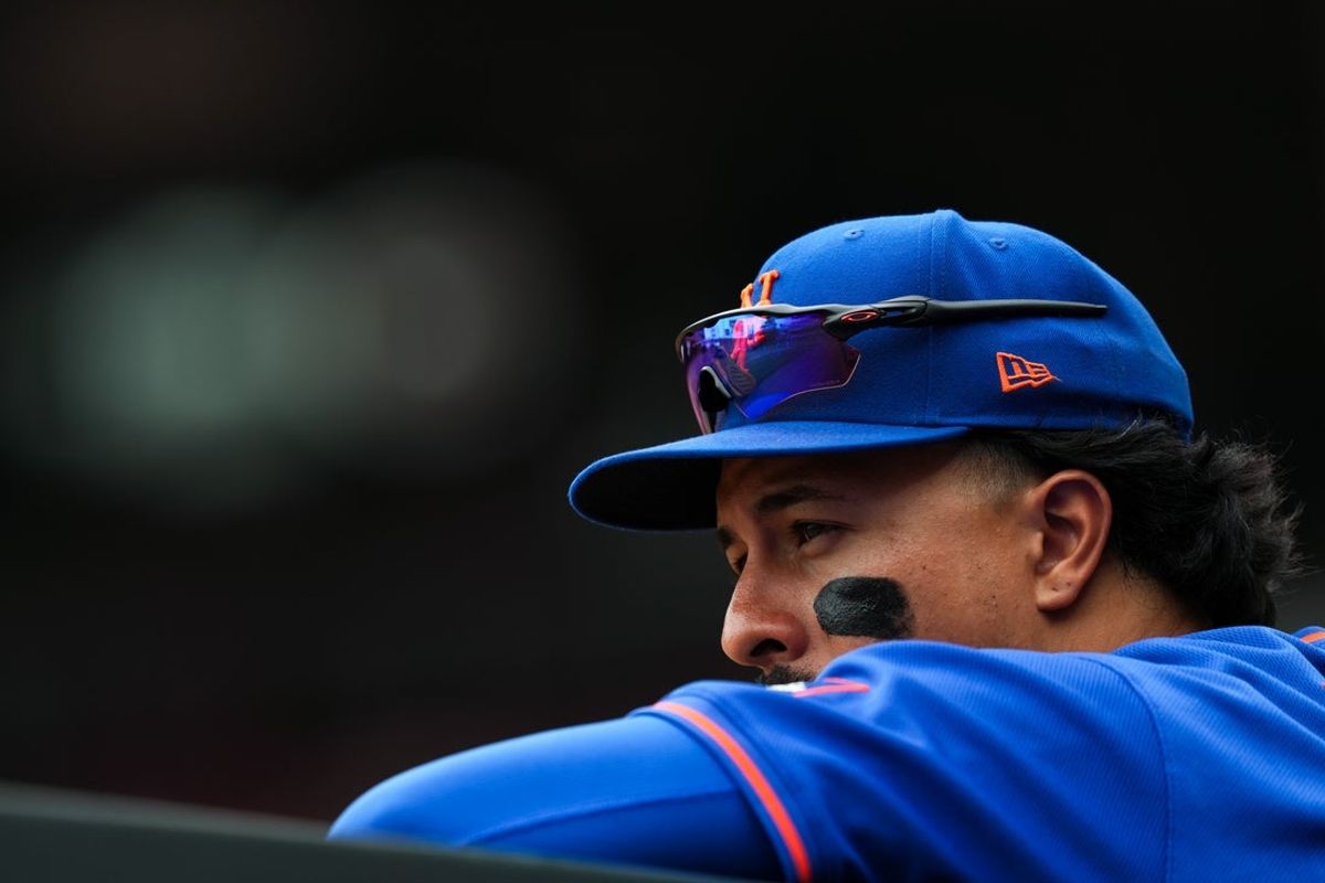 Jun 17, 2026; Cincinnati, Ohio, USA;  New York Mets first baseman Mark Vientos watches from the dugout during the game against the Cincinnati Reds in the eighth inning at Great American Ball Park. Mandatory Credit: Aaron Doster-Imagn Images