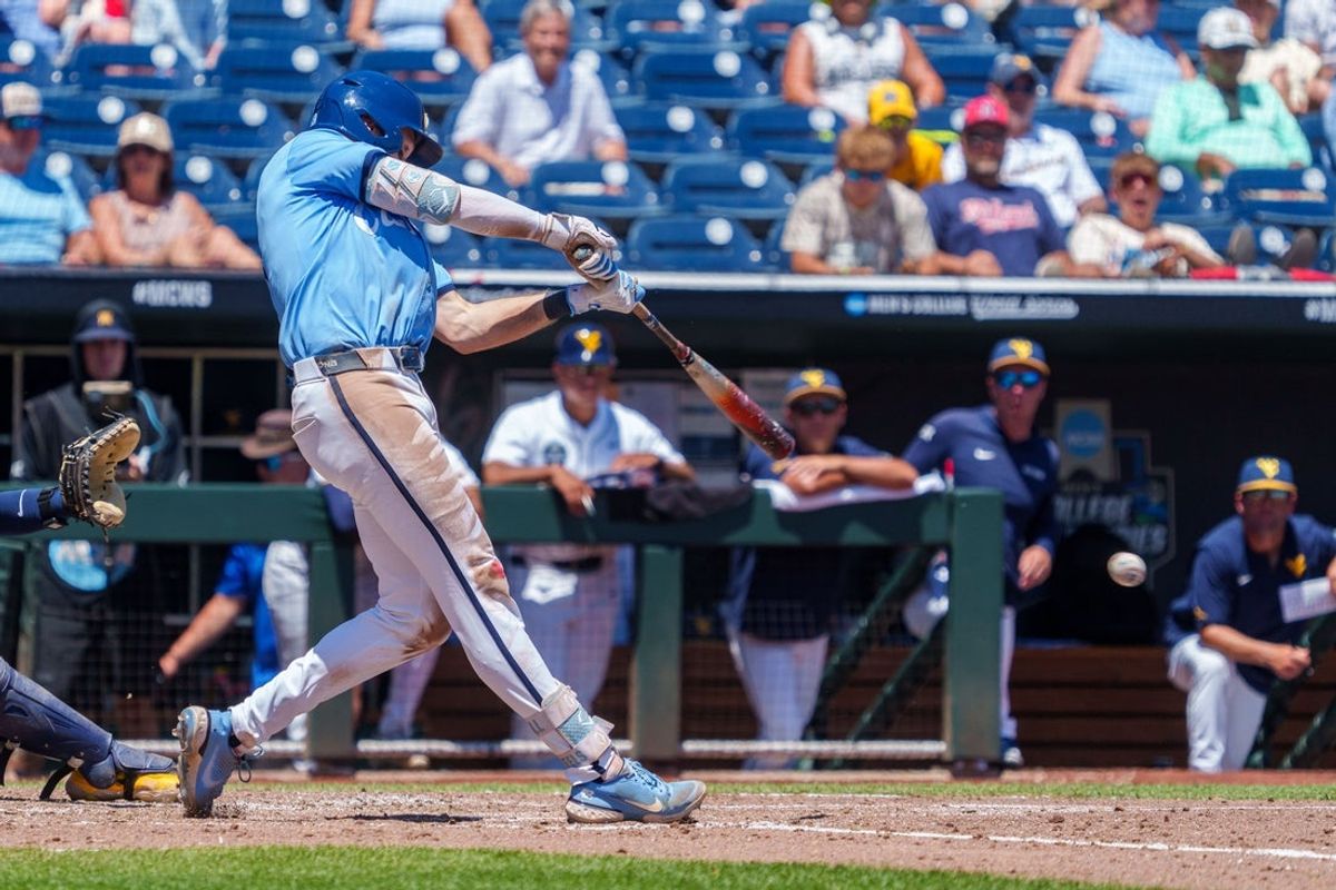 Jun 17, 2026; Omaha, NE, USA; North Carolina Tar Heels center fielder Owen Hull (8) drives in a run on a double against the West Virginia Mountaineers during the fourth inning at Charles Schwab Field. Mandatory Credit: Dylan Widger-Imagn Images