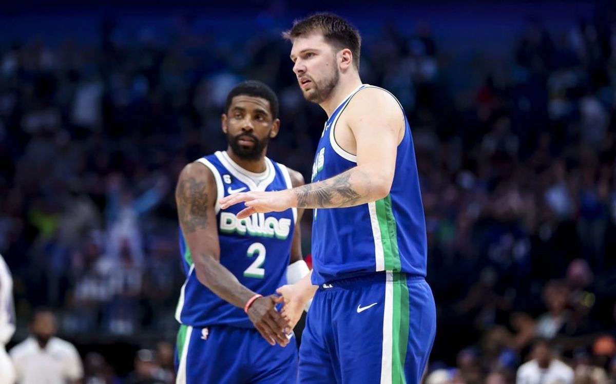 Apr 5, 2023; Dallas, Texas, USA;  Dallas Mavericks guard Luka Doncic (77) and Dallas Mavericks guard Kyrie Irving (2) react during the fourth quarter against the Sacramento Kings at American Airlines Center.