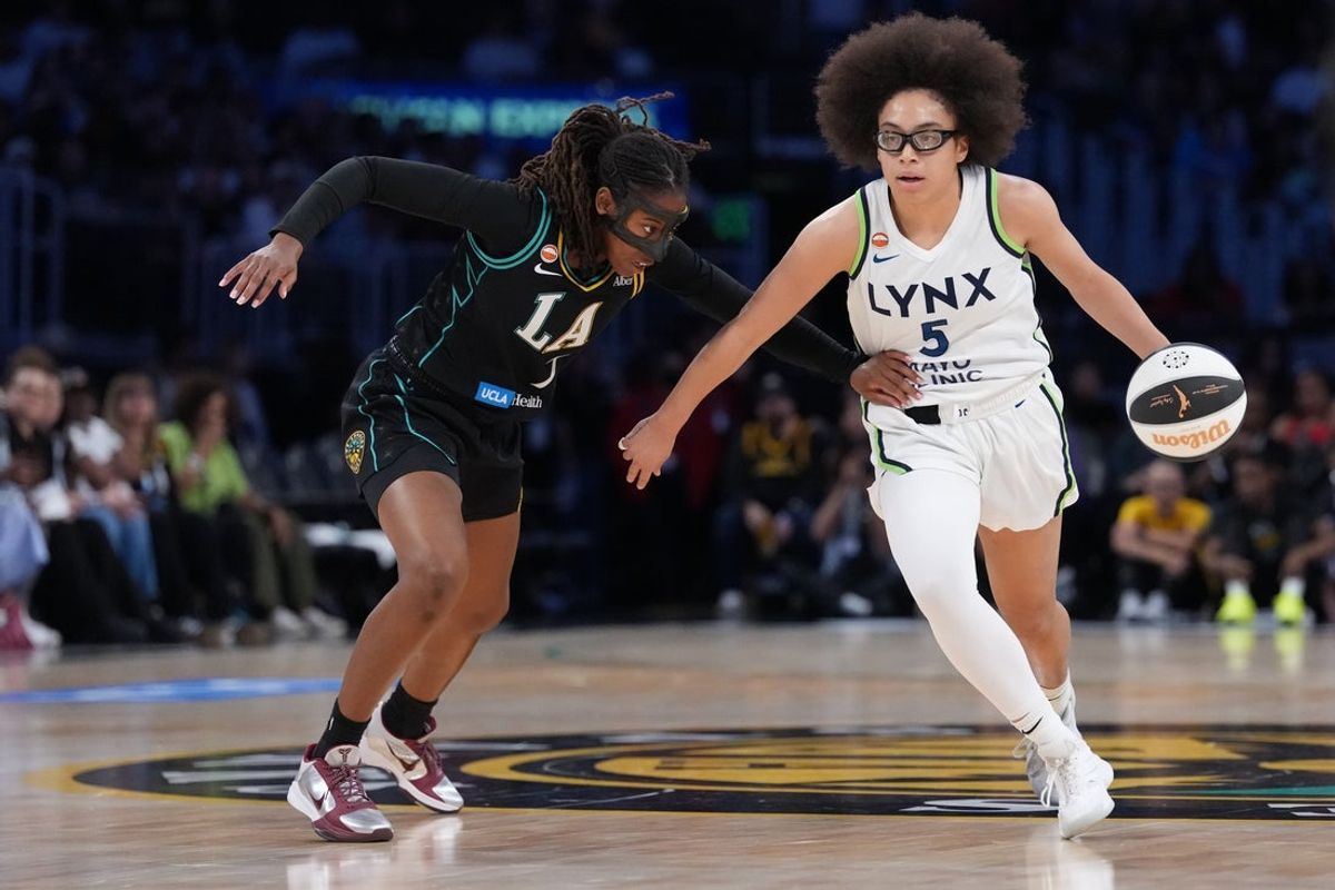 Jun 17, 2026; Los Angeles, California, USA; Minnesota Lynx guard Olivia Miles (5) drives to the basket against LA Sparks guard Ariel Atkins (7) in the first half at Crypto.com Arena. Mandatory Credit: Kirby Lee-Imagn Images