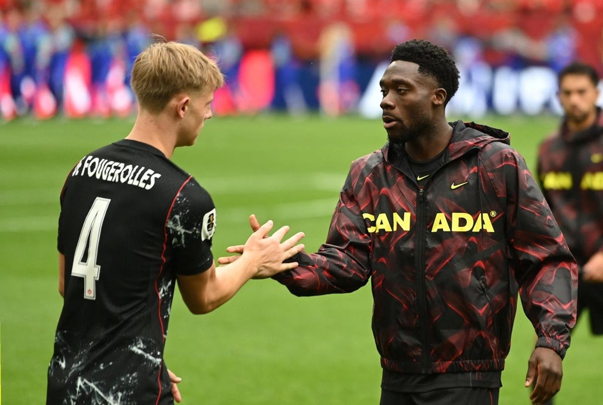 June 18, 2026; Vancouver, Canada; Canada's Luc de Fougerolles and Alphonso Davies before the match.  Mandatory Credit: Simon Fearn-Imagn Images