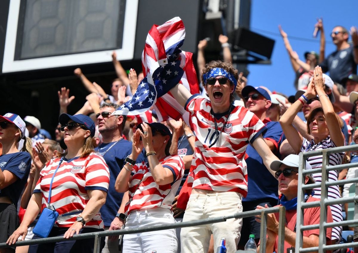 June 19, 2026; Seattle, Washington, U.S.; United States fans celebrate after Alex Freeman scores their second goal.  Mandatory Credit: Steven Bisig-Imagn Images