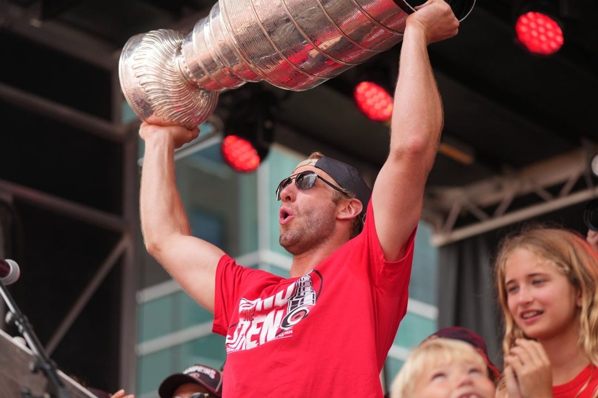 Jun 20, 2026; Raleigh, North Carolina, USA; Carolina Hurricanes center Jordan Staal (11) holds up the Stanley Cup Trophy during the Stanley Cup championship parade and rally at Raleigh. Mandatory Credit: James Guillory-Imagn Images