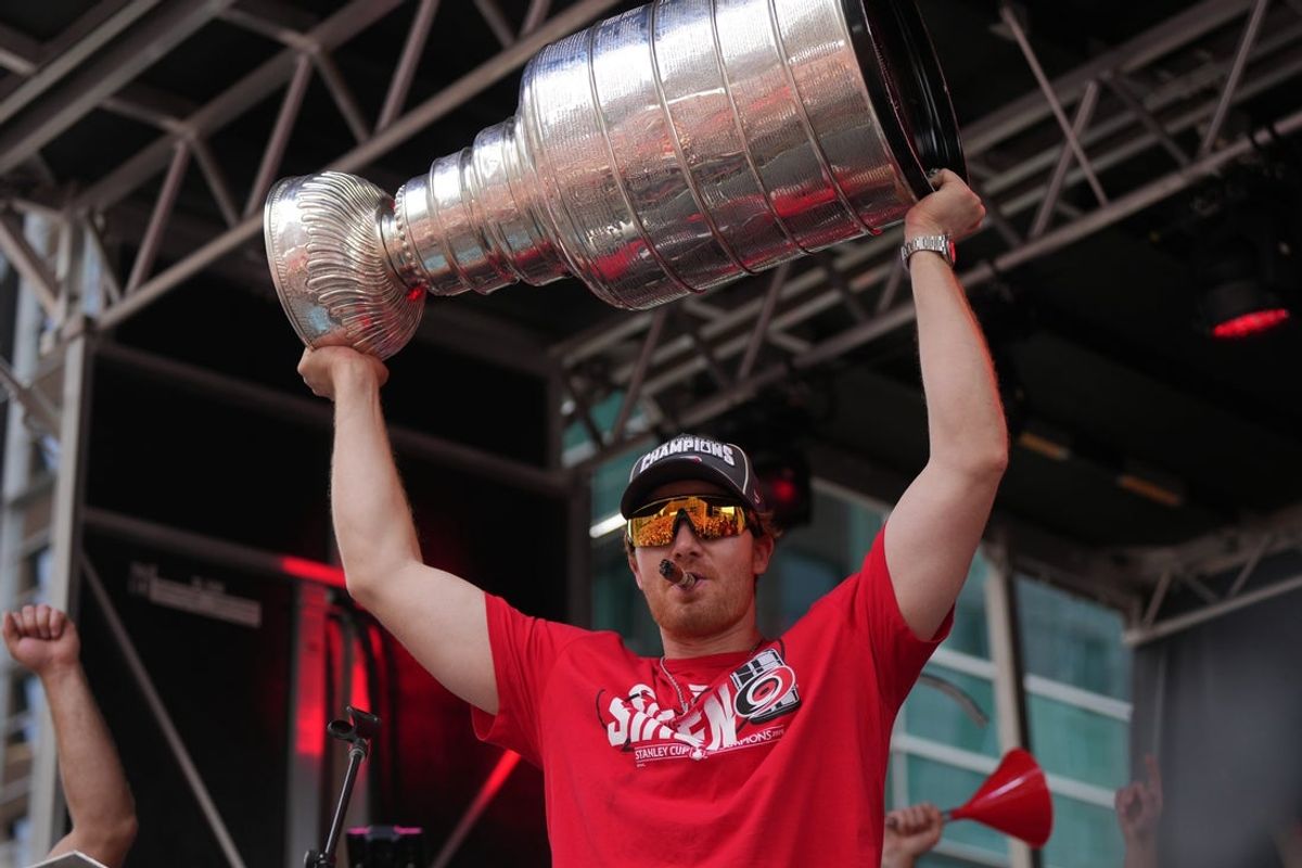 Jun 20, 2026; Raleigh, North Carolina, USA; Carolina Hurricanes goaltender Frederik Andersen (31) holds up the Stanley Cup trophy during the Stanley Cup championship parade and rally at Raleigh. Mandatory Credit: James Guillory-Imagn Images