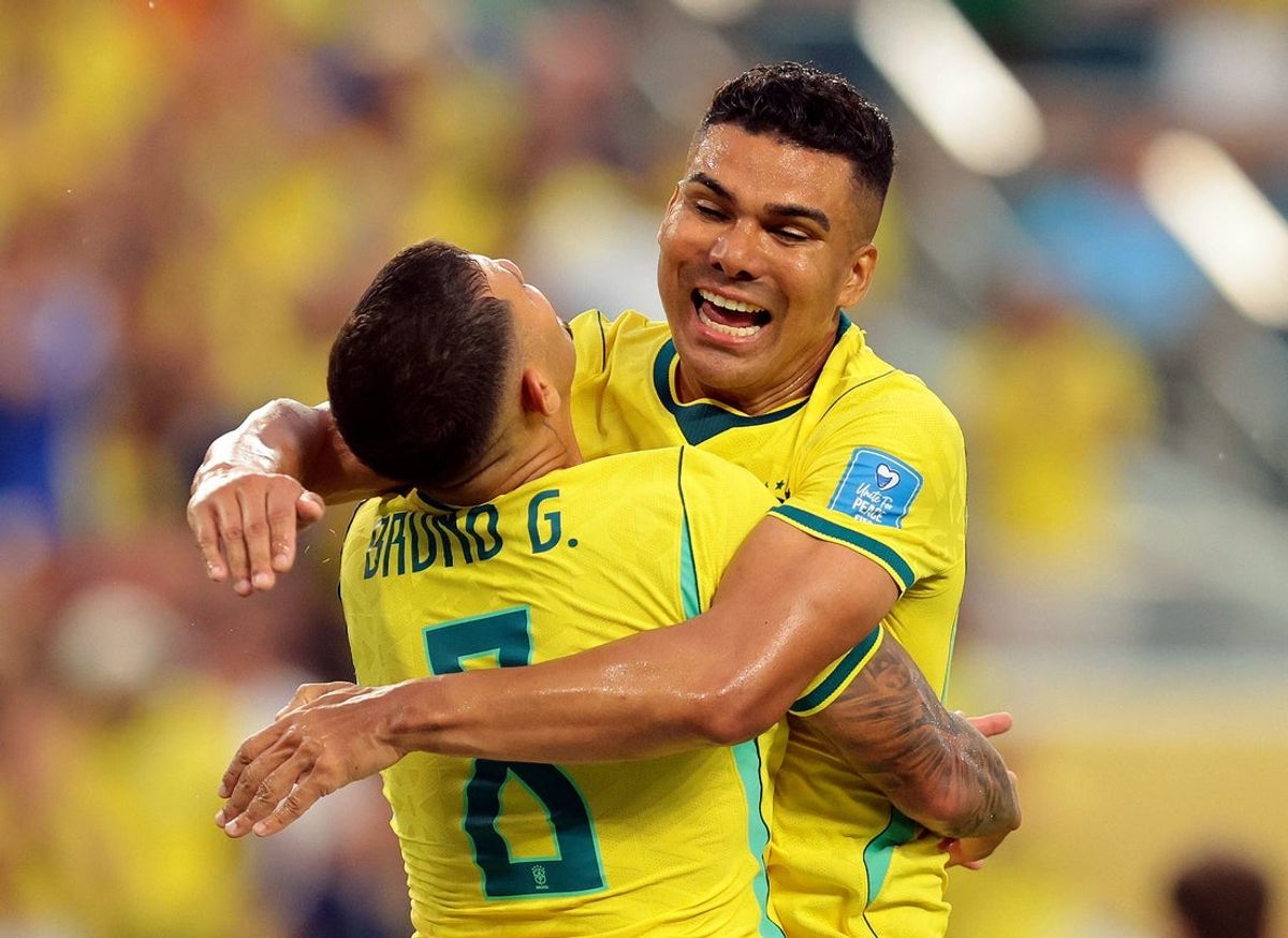 June 24, 2026; Miami Gardens, Florida, U.S.; Brazil's Bruno Guimaraes celebrates with Casemiro after Matheus Cunha scores their third goal.  Mandatory Credit: Sam Navarro-Imagn Images