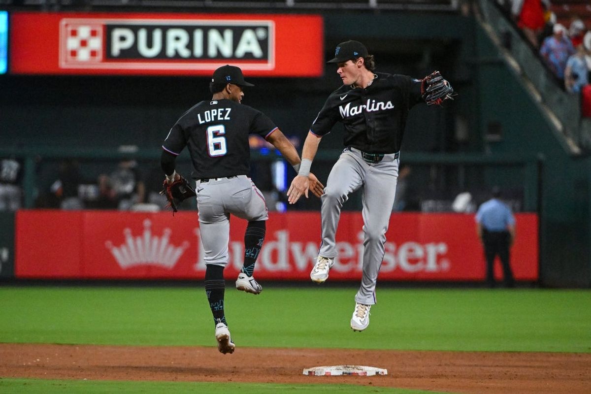 Jun 26, 2026; St. Louis, Missouri, USA; Miami Marlins left fielder Griffin Conine (18) celebrates with shortstop Otto Lopez (6) after the Marlins defeated the St. Louis Cardinals at Busch Stadium. Mandatory Credit: Jeff Curry-Imagn Images