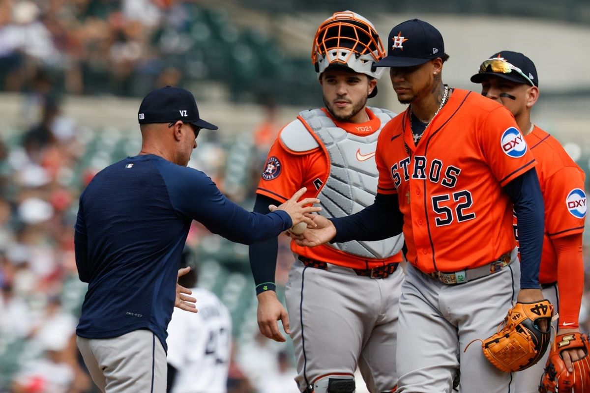 Jun 28, 2026; Detroit, Michigan, USA;  Houston Astros manager Joe Espada (19) takes the ball to relieve pitcher Bryan Abreu (52) in the seventh inning against the Detroit Tigers at Comerica Park. Mandatory Credit: Rick Osentoski-Imagn Images