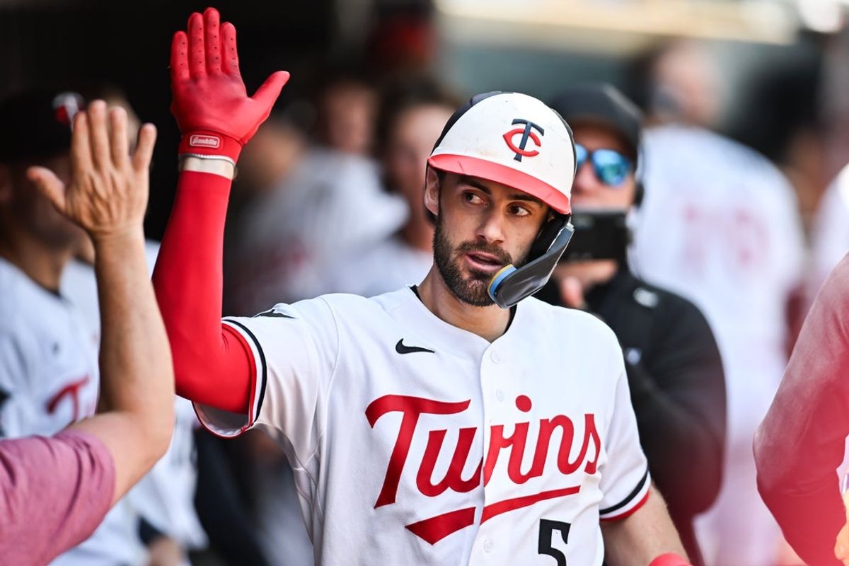 Jun 28, 2026; Minneapolis, Minnesota, USA; Minnesota Twins shortstop Ryan Kreidler (5) reacts with teammates after hitting a home run during the seventh inning against the Colorado Rockies at Target Field. Mandatory Credit: Jeffrey Becker-Imagn Images