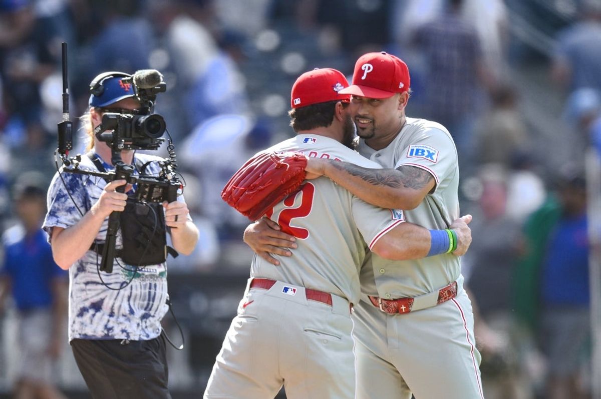 Jun 28, 2026; New York City, New York, USA; Philadelphia Phillies designated hitter Kyle Schwarber (12) and pitcher Jhoan Duran (59) embrace after winning against the New York Mets at Citi Field. Mandatory Credit: John Jones-Imagn Images