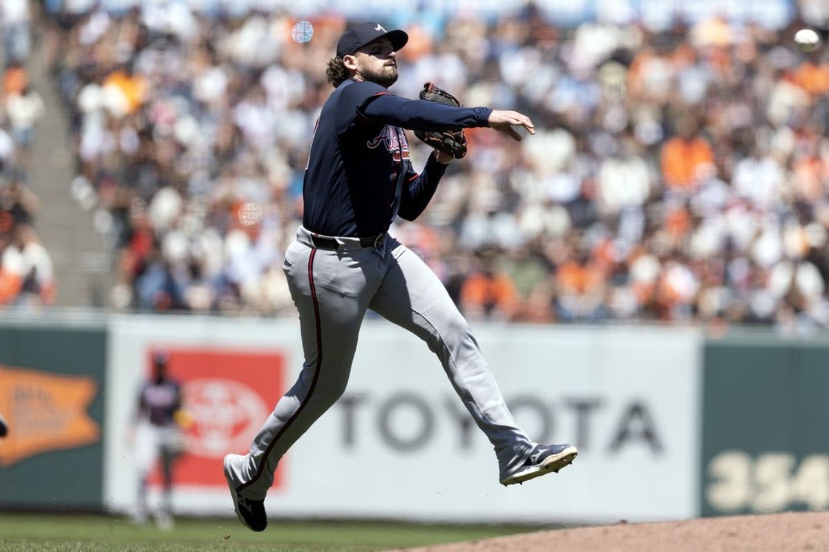 Jun 28, 2026; San Francisco, California, USA; Atlanta Braves third baseman Austin Riley (27) leaves his feet to attempt to throw out San Francisco Giants first baseman Rafael Devers at first base during the sixth inning at Oracle Park. Mandatory Credit: D. Ross Cameron-Imagn Images