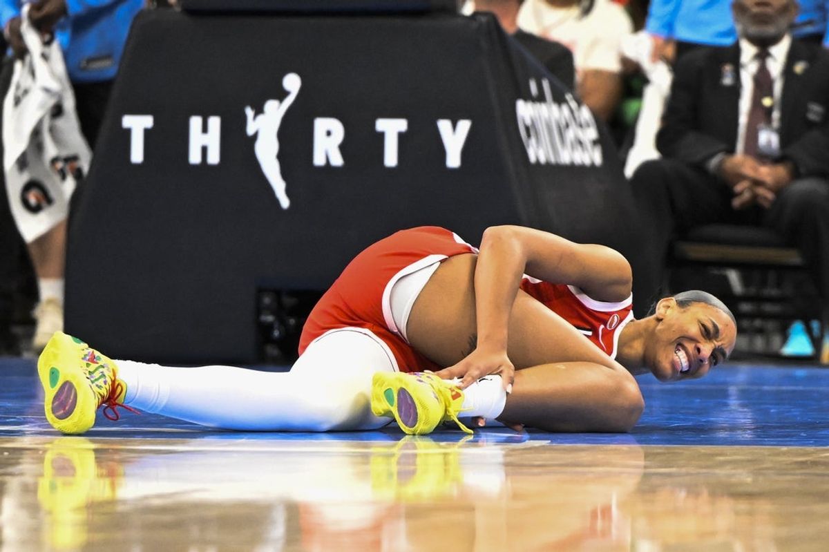 Jun 28, 2026; Chicago, Illinois, USA;  Las Vegas Aces center A'ja Wilson (22) grimaces after falling during the second half against the Chicago Sky at United Center. Mandatory Credit: Matt Marton-Imagn Images