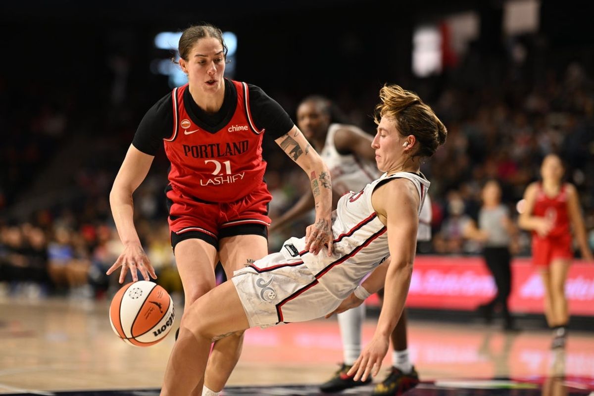 Jun 28, 2026; Washington, District of Columbia, USA; Washington Mystics guard Alicia Florez (2) draws a charge against Portland Fire forward Emily Engstler (21) during the first overtime at CareFirst Arena. Mandatory Credit: Rafael Suanes-Imagn Images