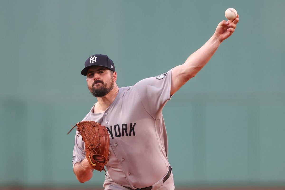 Jun 28, 2026; Boston, Massachusetts, USA; New York Yankees starting pitcher Carlos Rodon (55) delivers a pitch during the first inning against the Boston Red Sox at Fenway Park. Mandatory Credit: Paul Rutherford-Imagn Images