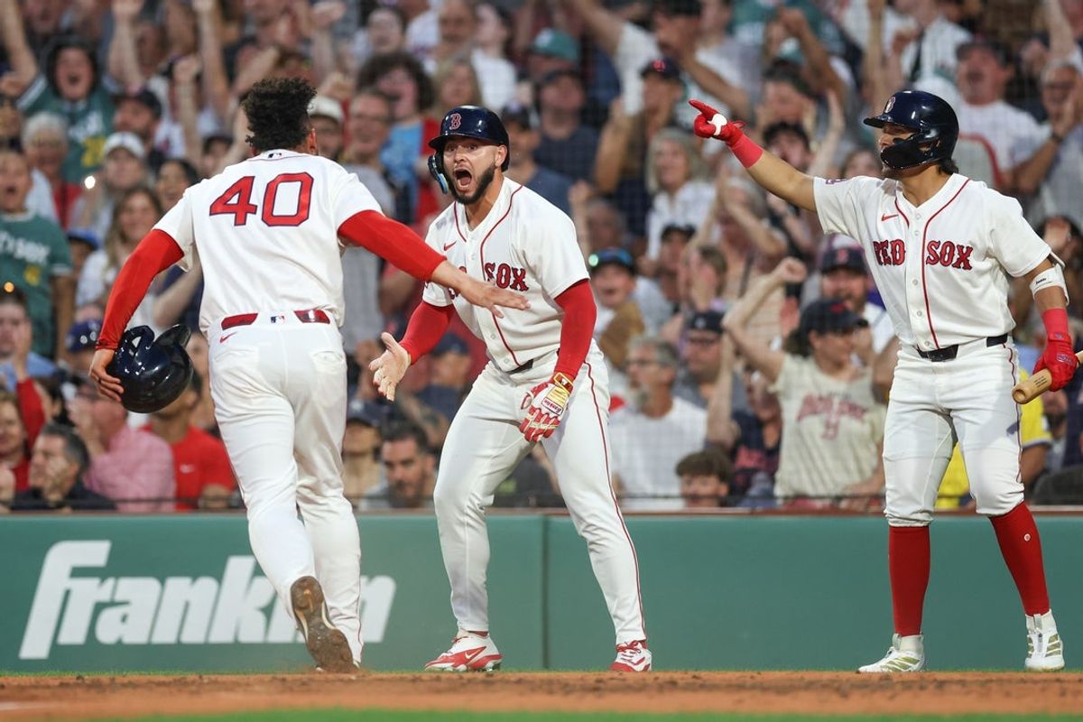 Jun 28, 2026; Boston, Massachusetts, USA; Boston Red Sox right fielder Wilyer Abreu (52) celebrates with Boston Red Sox first baseman Willson Contreras (40) after scoring during the during the fourth inning against the New York Yankees at Fenway Park. Mandatory Credit: Paul Rutherford-Imagn Images