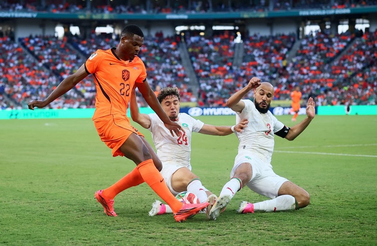 June 29, 2026; Monterrey, Mexico; Netherlands' Denzel Dumfries in action with Morocco's Neil El Aynaoui and Noussair Mazraoui.  Mandatory Credit: Eloisa Sanchez-Reuters via Imagn Images
