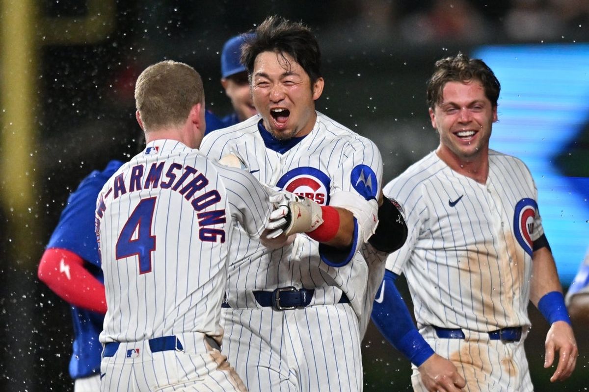 Jun 29, 2026; Chicago, Illinois, USA; Chicago Cubs designated hitter Seiya Suzuki (27) celebrates his walk-off single with teammates after defeating the San Diego Padres in the ninth inning at Wrigley Field. Mandatory Credit: Patrick Gorski-Imagn Images
