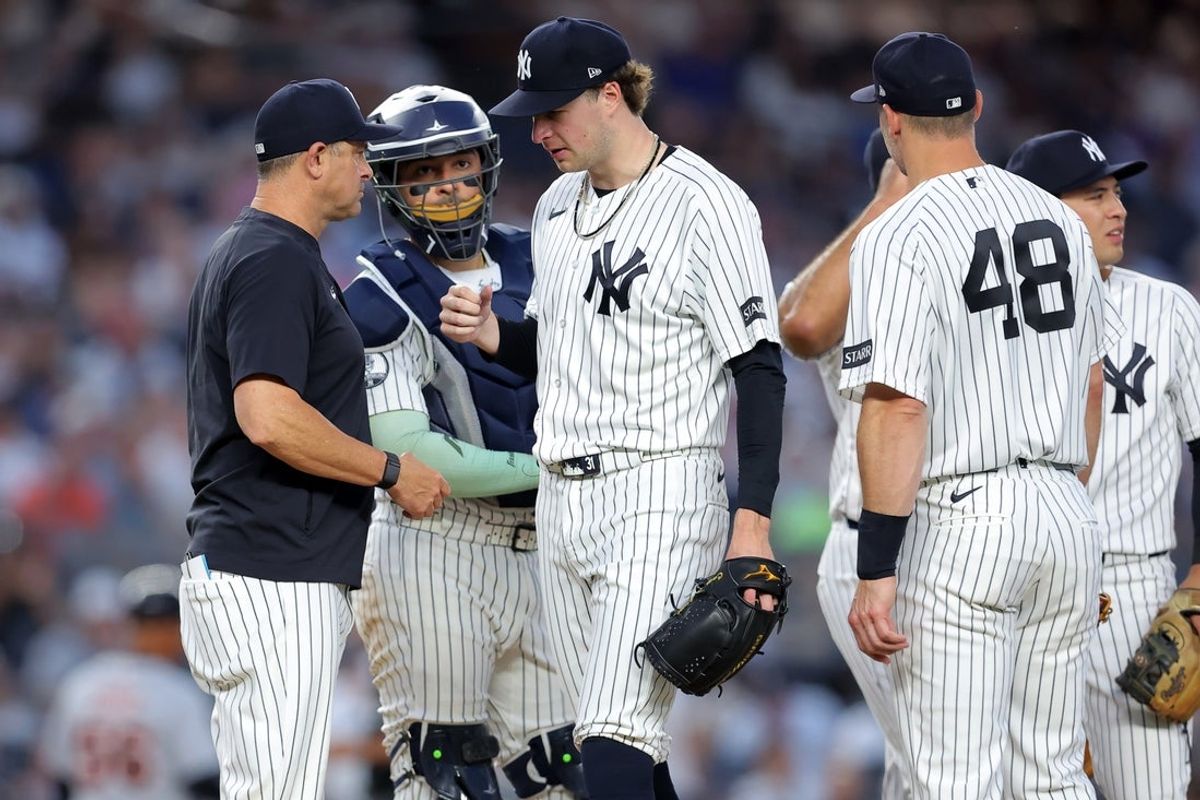 Jun 30, 2026; Bronx, New York, USA; New York Yankees manager Aaron Boone (17) removes starting pitcher Cam Schlittler (31) from the game against the Detroit Tigers during the fifth inning at Yankee Stadium. Mandatory Credit: Brad Penner-Imagn Images