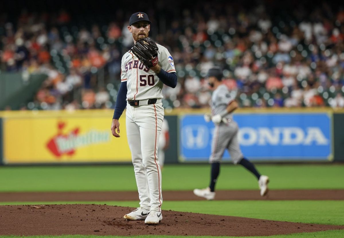 Jun 30, 2026; Houston, Texas, USA; Houston Astros starting pitcher Mike Burrows (50) reacts after walking in Minnesota Twins left fielder Trevor Larnach (9) in the first inning at Daikin Park. Mandatory Credit: Thomas Shea-Imagn Images
