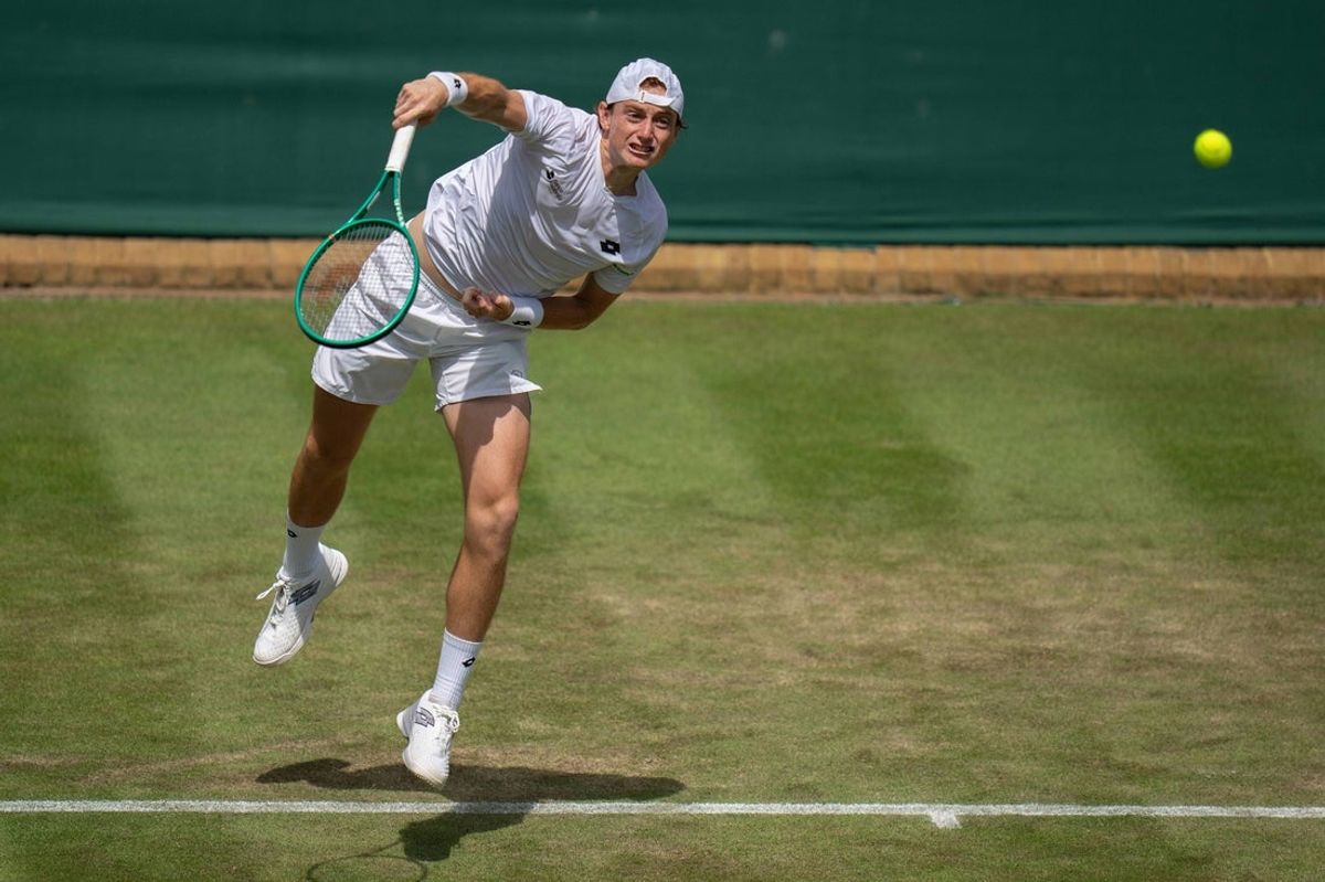 Jul 1, 2026; London, United Kingdom;  Ignacio Buse of Peru serves the ball during his match against Jensen Brooksby of the United States Ignacio base of Peru on day three at All England Lawn Tennis and Croquet Club.  Mandatory Credit: Susan Mullane-Imagn Images