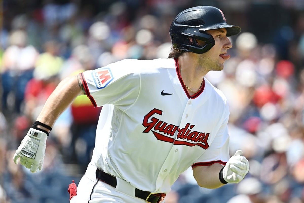 Jul 1, 2026; Cleveland, Ohio, USA; Cleveland Guardians right fielder Chase DeLauter (24) hits a double during the first inning against the Texas Rangers at Progressive Field. Mandatory Credit: Ken Blaze-Imagn Images