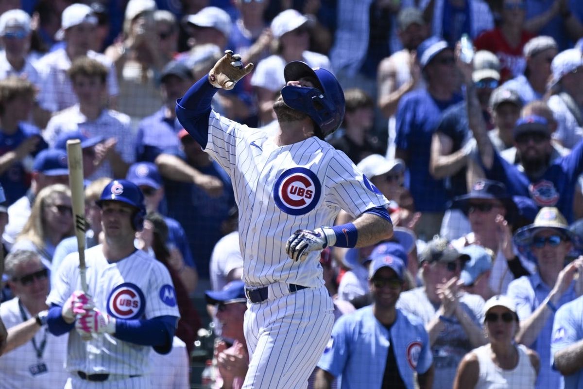 Jul 1, 2026; Chicago, Illinois, USA;  Chicago Cubs shortstop Dansby Swanson points after he hits a three-run home run  against the San Diego Padres during the third inning at Wrigley Field. Mandatory Credit: Matt Marton-Imagn Images