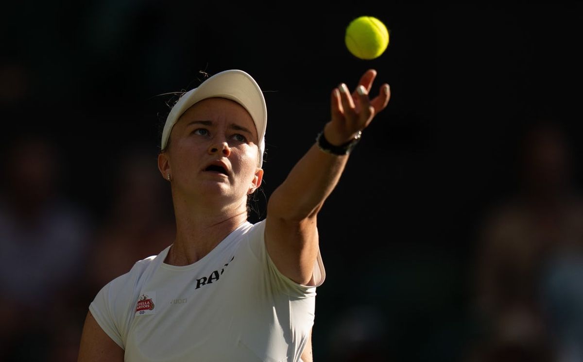 Jul 1, 2026; London, United Kingdom; Barbora Krejcikova of the Czech Republic tosses the ball to serve during her match against Mirra Andreeva on day three at All England Lawn Tennis and Croquet Club.  Mandatory Credit: Susan Mullane-Imagn Images