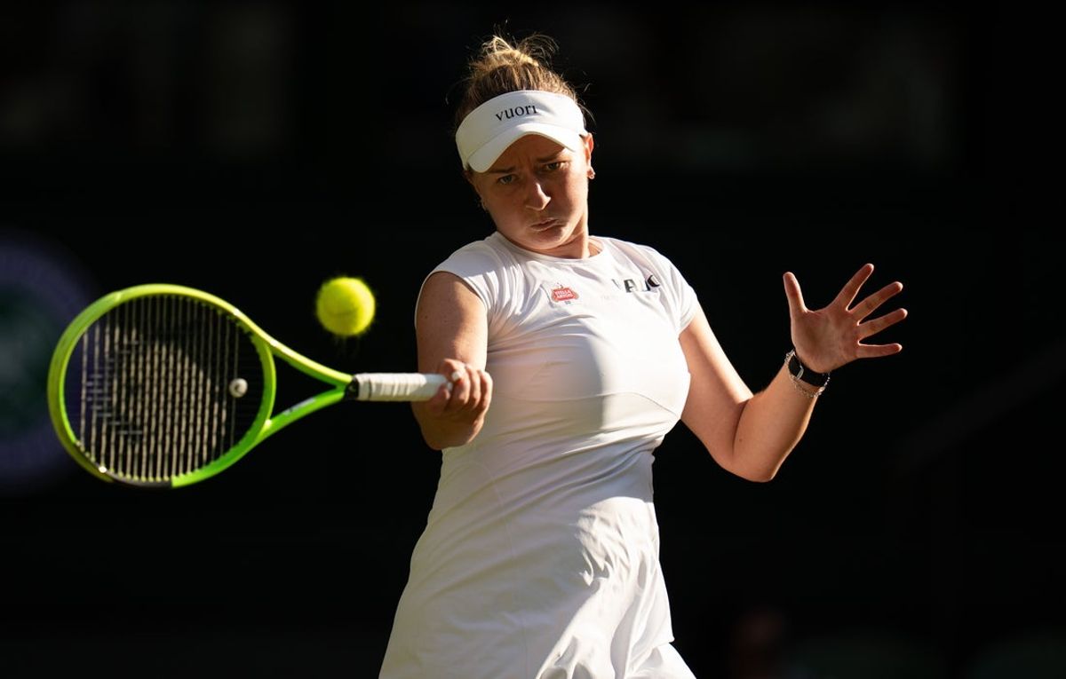 Jul 1, 2026; London, United Kingdom; Barbora Krejcikova of the Czech Republic returns a shot during her match against Mirra Andreeva on day three at All England Lawn Tennis and Croquet Club.  Mandatory Credit: Susan Mullane-Imagn Images