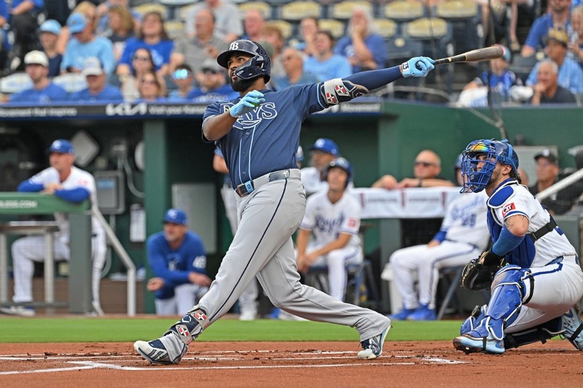 Jul 1, 2026; Kansas City, Missouri, USA;  Tampa Bay Rays third baseman Junior Caminero (13) hits a two-run home run in the first inning against the Kansas City Royals at Kauffman Stadium. Mandatory Credit: Peter Aiken-Imagn Images