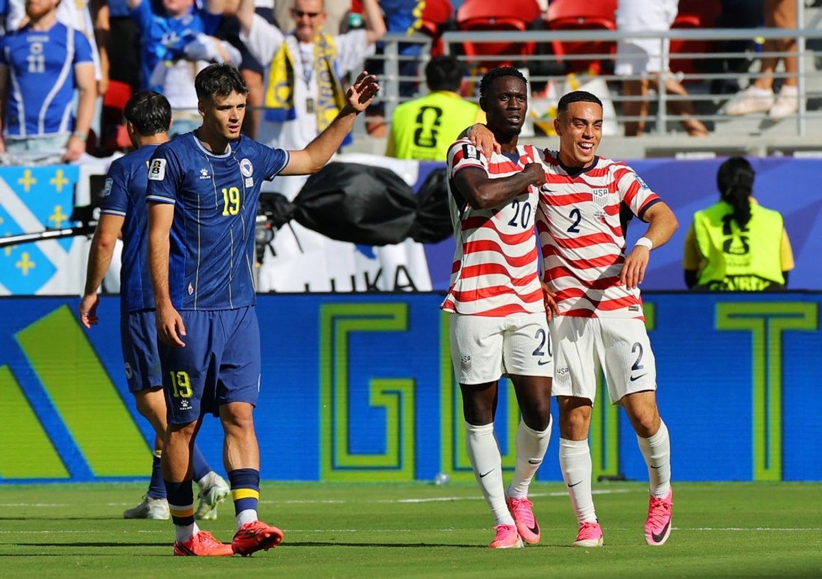 July 1, 2026; Santa Clara, California, U.S.; Folarin Balogun of the U.S. celebrates scoring their first goal with Sergino Dest as Bosnia and Herzegovina's Kerim Alajbegovic looks dejected.  Mandatory Credit: Carlos Barria-Reuters via Imagn Images