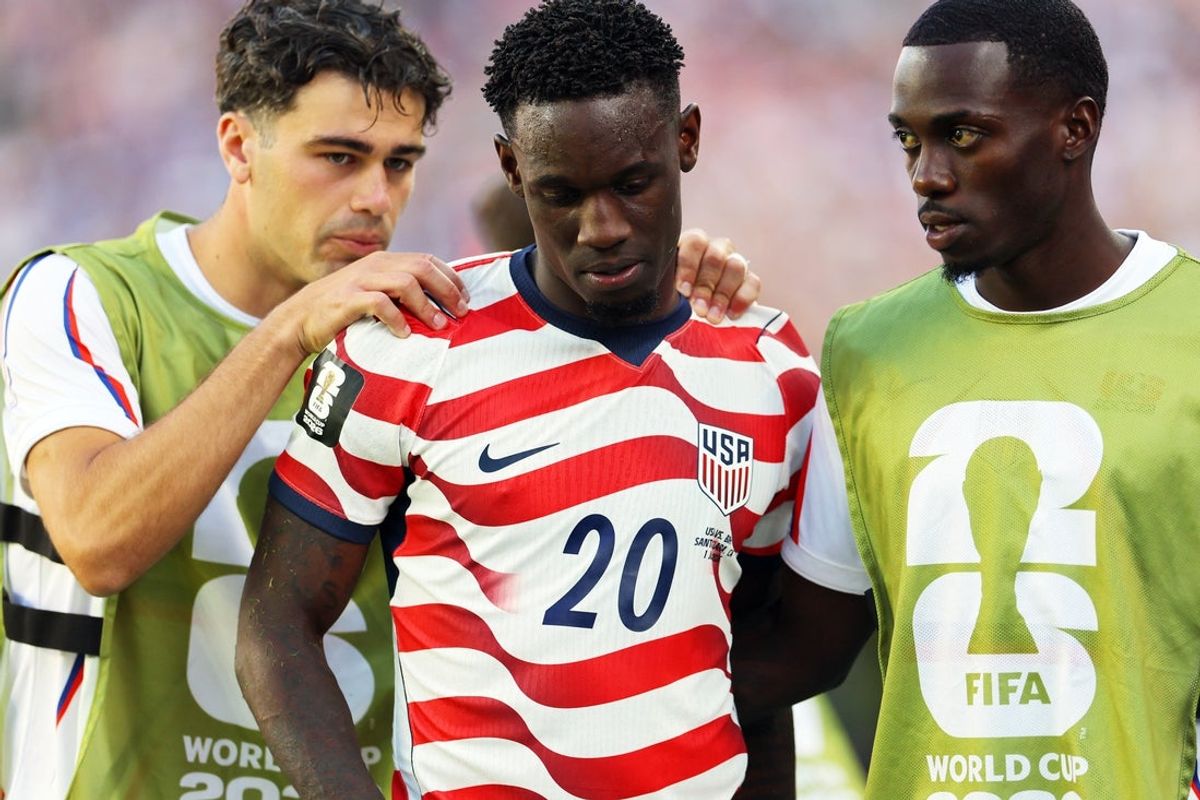 July 1, 2026; Santa Clara, California, U.S.; Folarin Balogun of the U.S. is consoled by Giovanni Reyna and Timothy Weah after receiving a red card.  Mandatory Credit: Carlos Barria-Reuters via Imagn Images