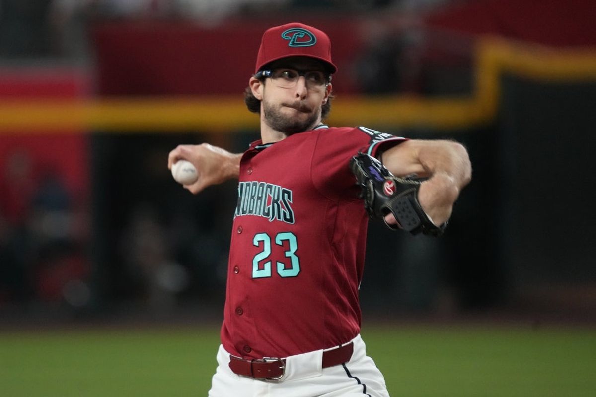 Jul 1, 2026; Phoenix, Arizona, USA; Arizona Diamondbacks pitcher Zac Gallen (23) throws against the San Francisco Giants in the first inning at Chase Field. Mandatory Credit: Rick Scuteri-Imagn Images