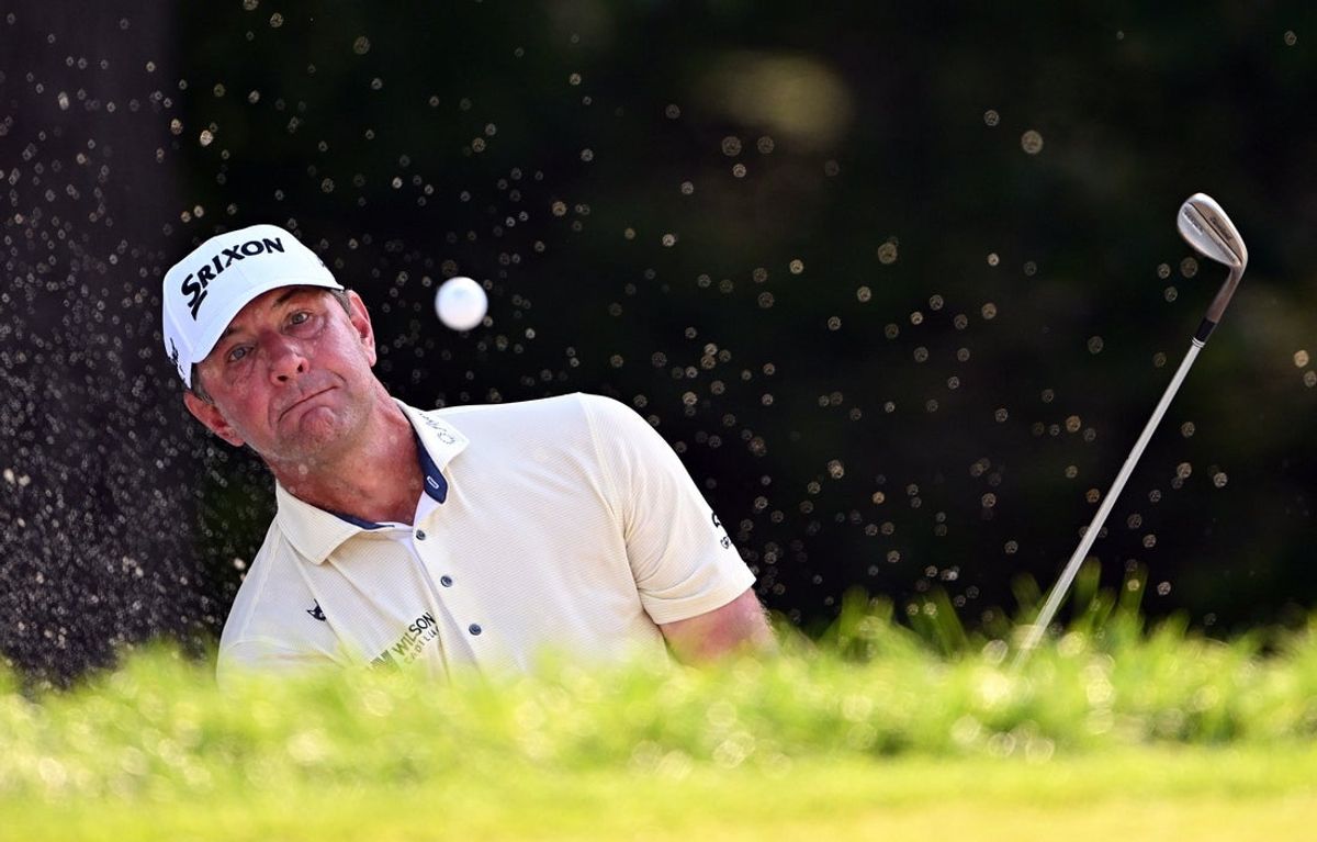 Jul 3, 2026; Silvis, Illinois, USA; Lucas Glover hits a shot out of a bunker on the 9th hole during the second round of the John Deere Classic golf tournament. Mandatory Credit: Marc Lebryk-Imagn Images