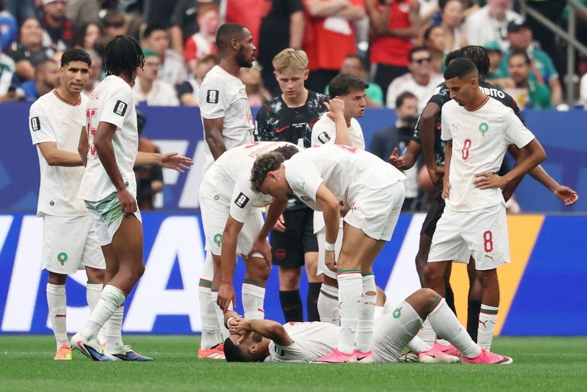 July 4, 2026; Houston, Texas, U.S.; Morocco's Ismael Saibari is checked on by teammates after sustaining an injury.  Mandatory Credit: Troy Taormina-Imagn Images